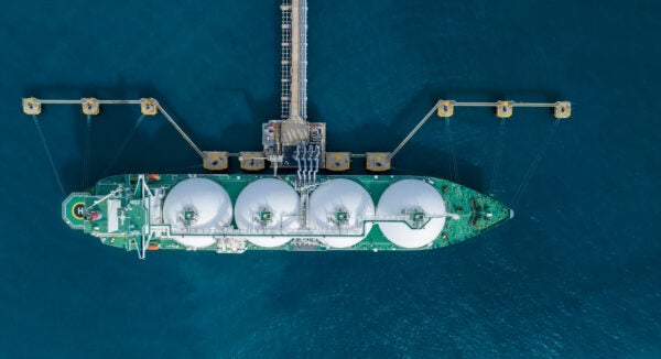 Birds-eye view of marine tanker in the ocean relating to the use of hydrogen as a sustainable resource in marine shipping.